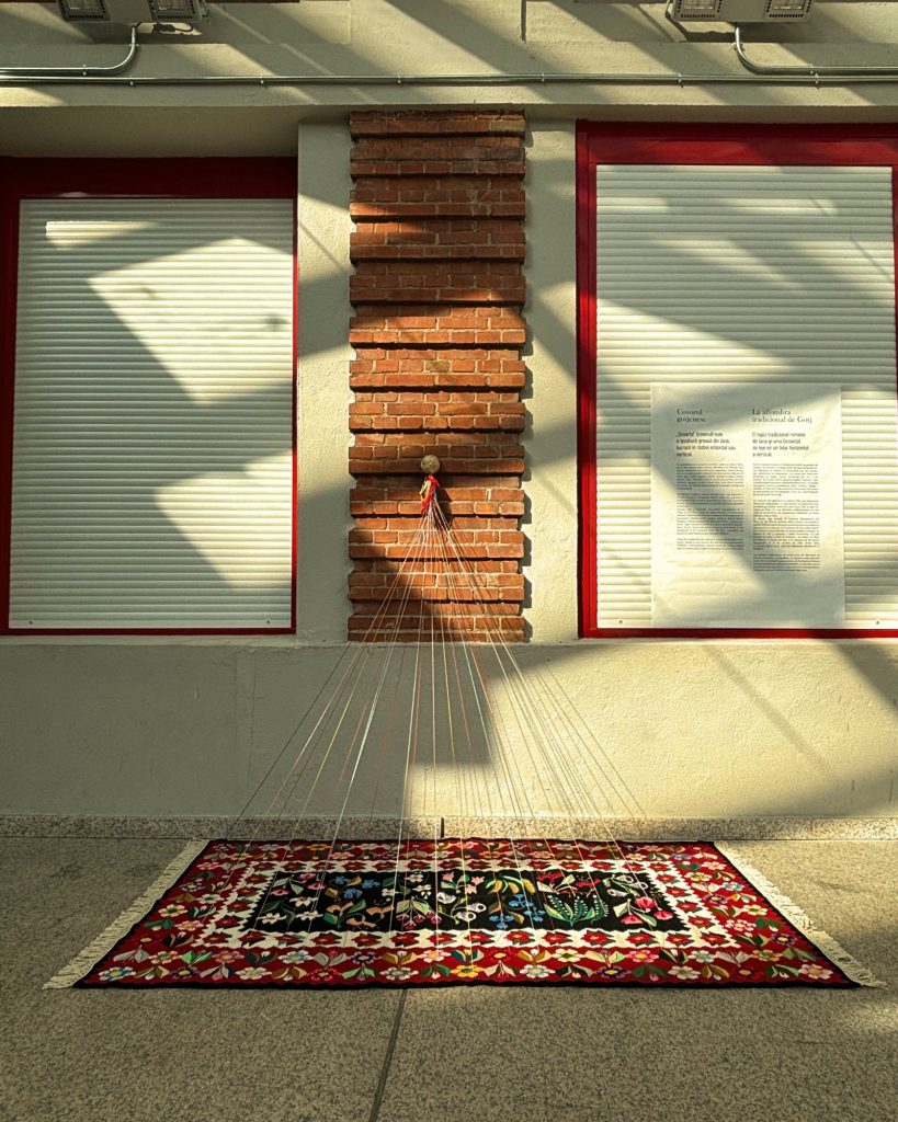 Oltenian carpet with threads rising to a brick column